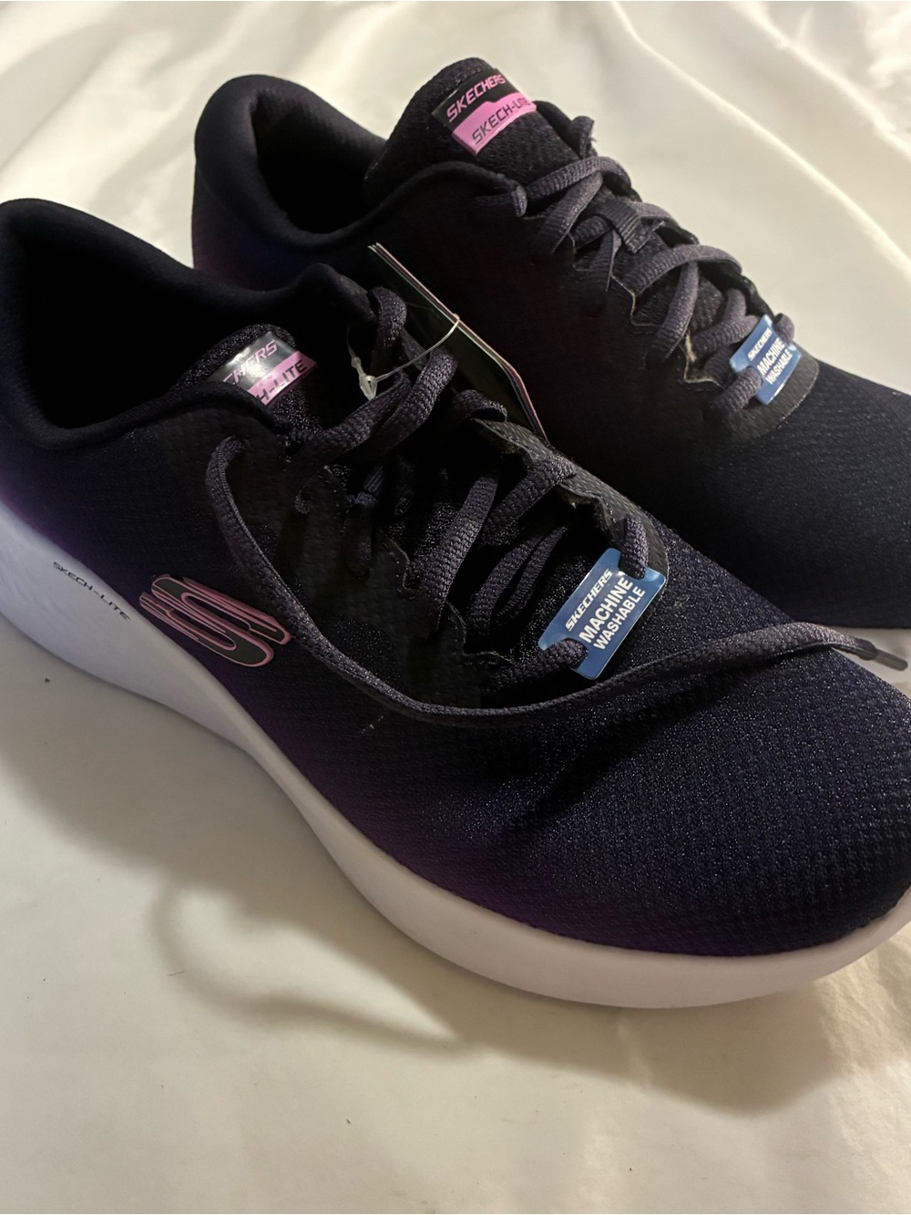 Skechers Women’s Black Athletic Sneakers with Pink Logo Accents